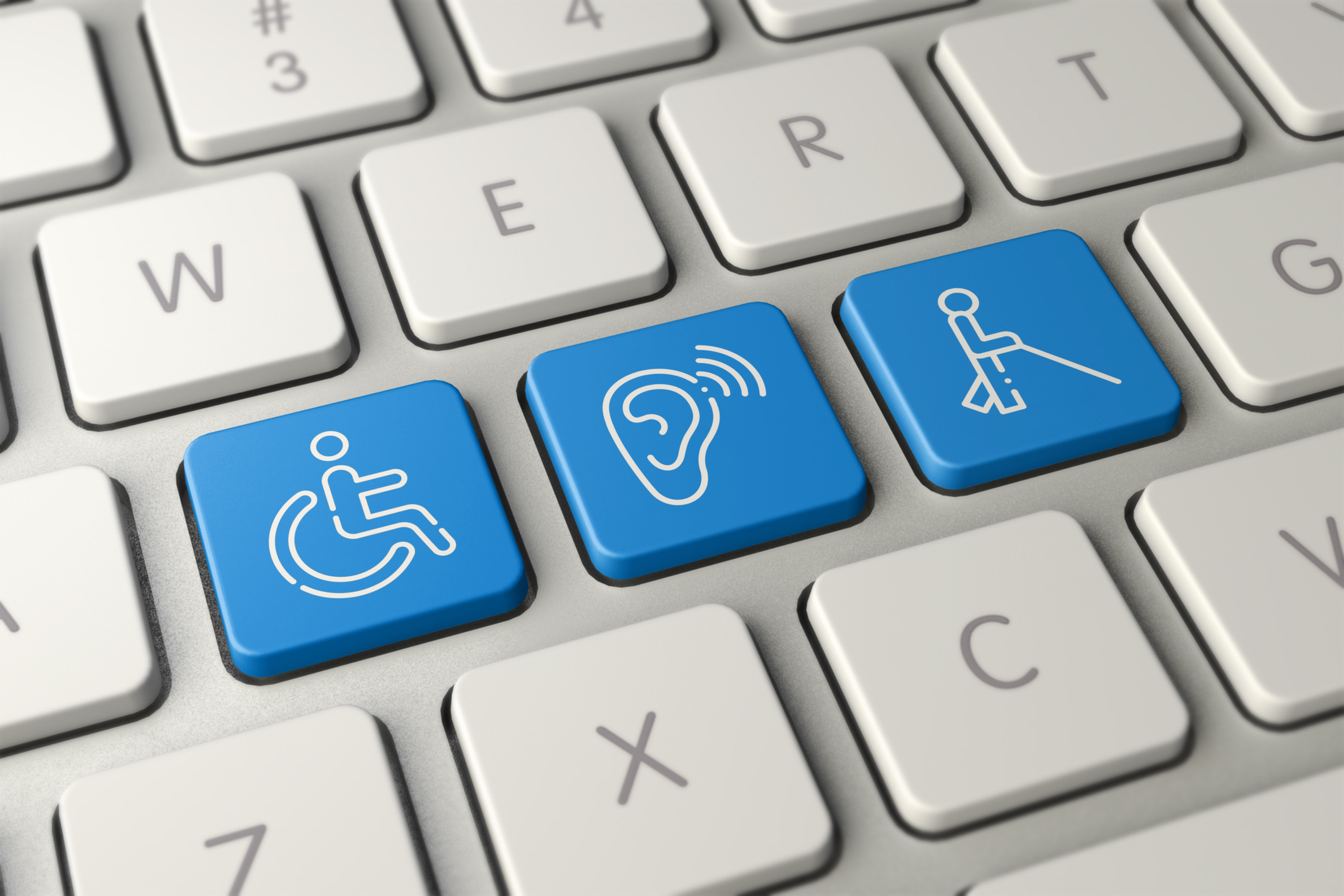 Laptop keyboard with keys replaced to show a wheelchair symbol, hearing loss symbol and a blind person symbol.