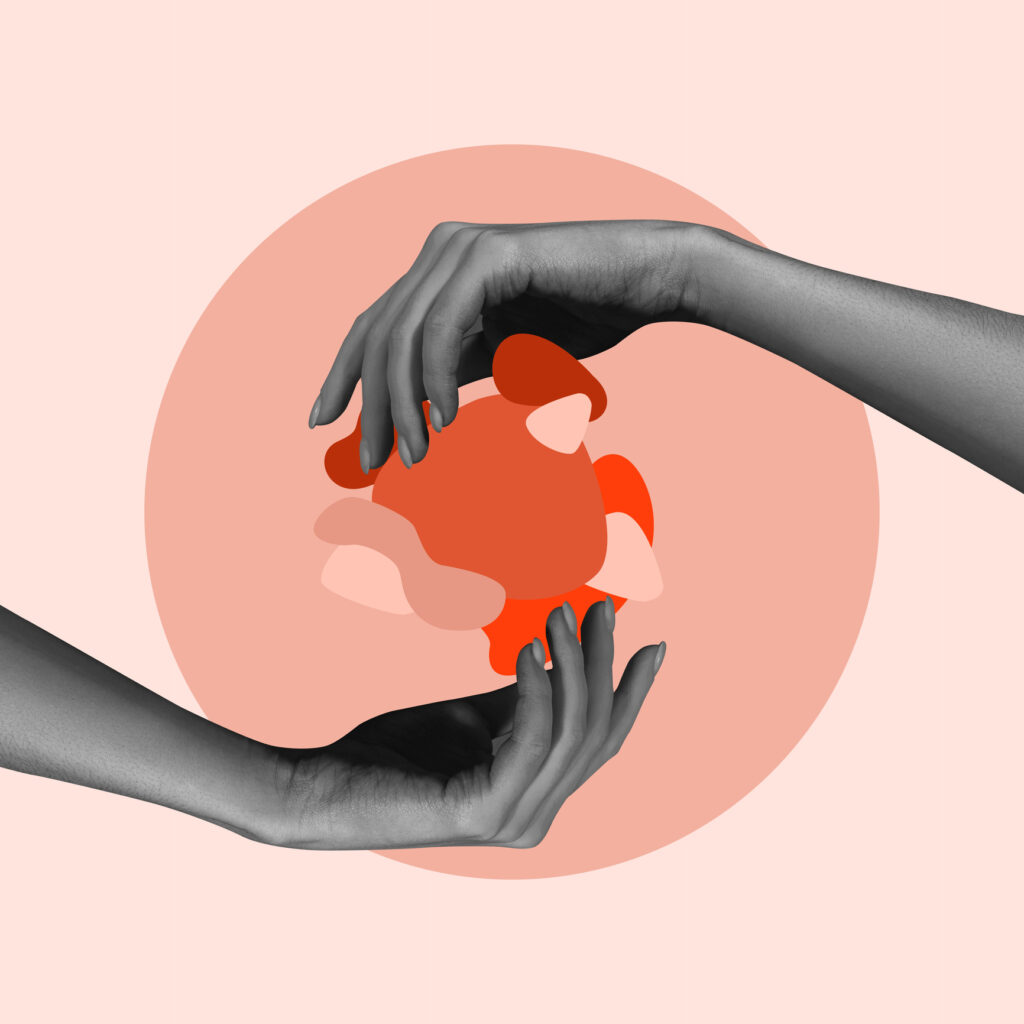 Abstract image of hands holding a ball of red and orange shapes