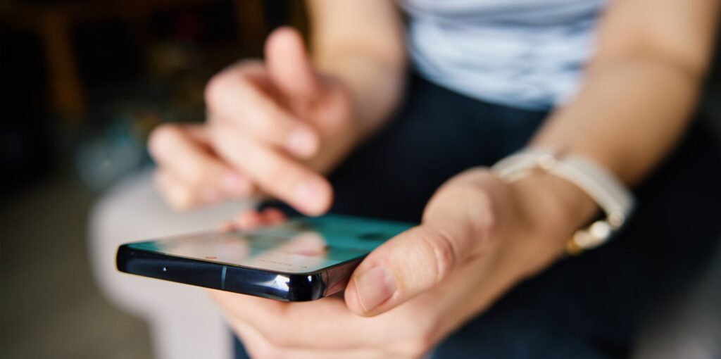 person scrolling on phone
