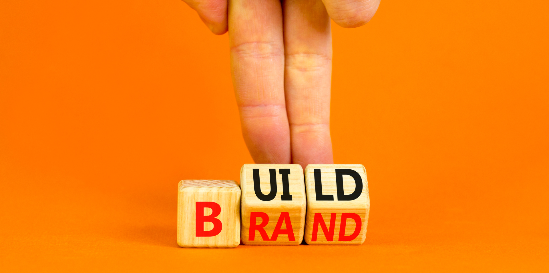 wooden blocks featuring the words build brand