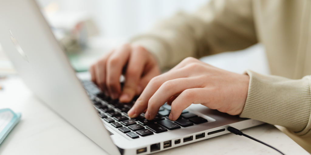 How to Build Brand Authority in the Digital Space 2 woman typing on a laptop